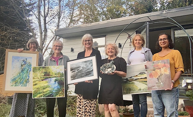 Just a few of the Acorn artists - standing outside, proudly holding their artwork