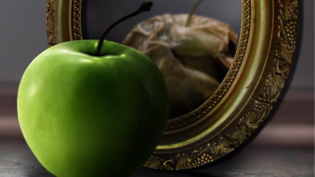 Fresh apple reflected rotten in mirror